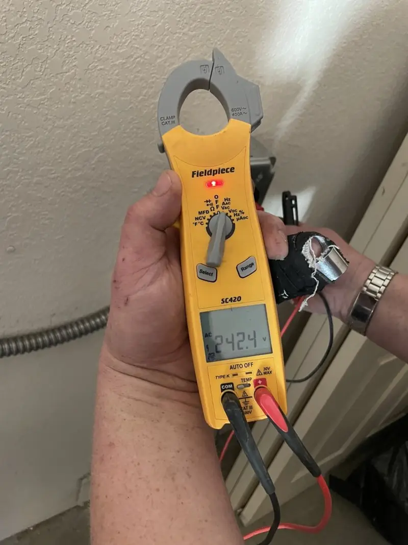Voltage testing with clamp meter during Circuit Breaker Repair in West Union